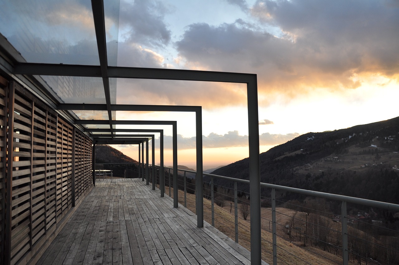 Timber or composite decking integrated with a pergola structure