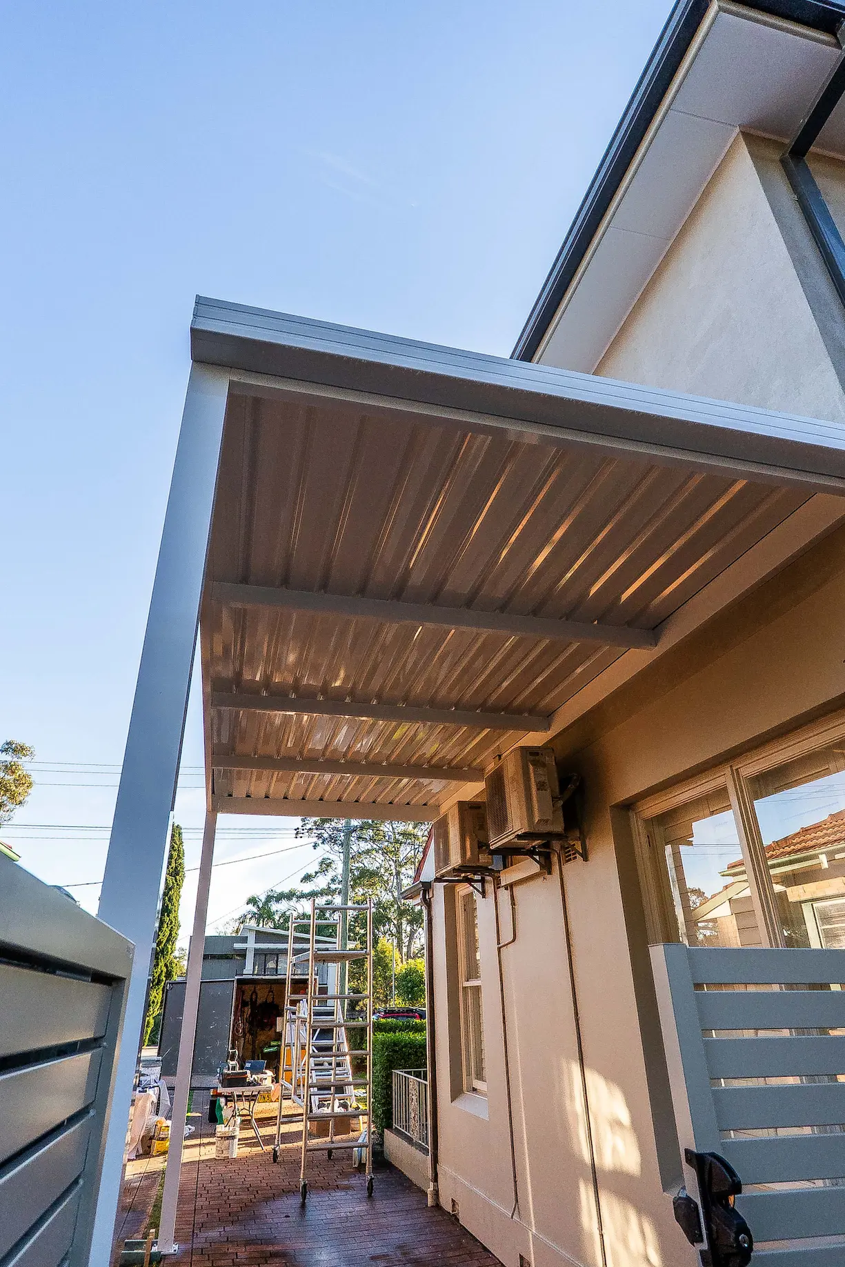 Anchoring detail where a carport post meets the concrete driveway