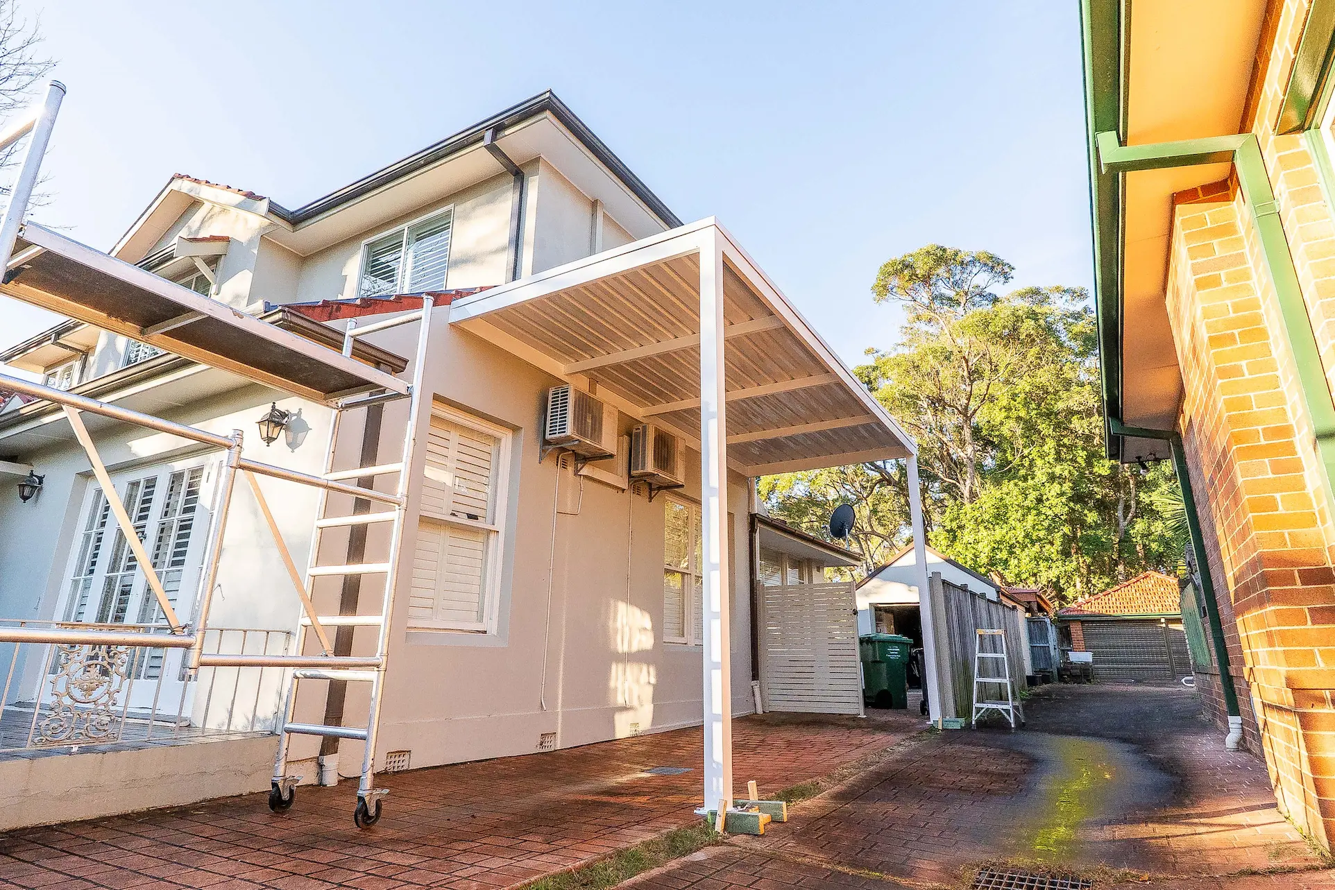 Landscape shot of Colorbond roof sheets and fascia line across the carport bay