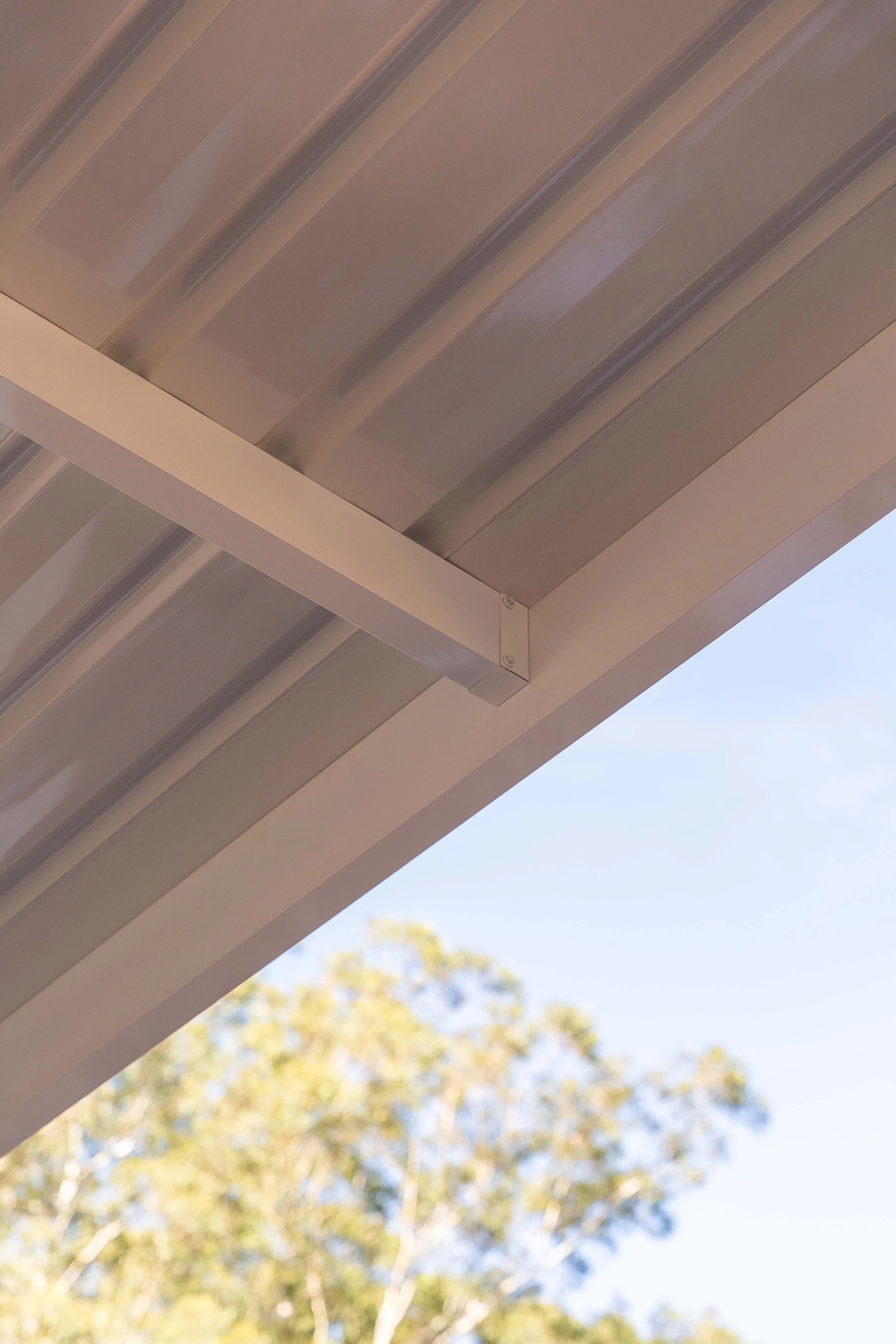 Vertical shot of finished paintwork on posts and beam undersides