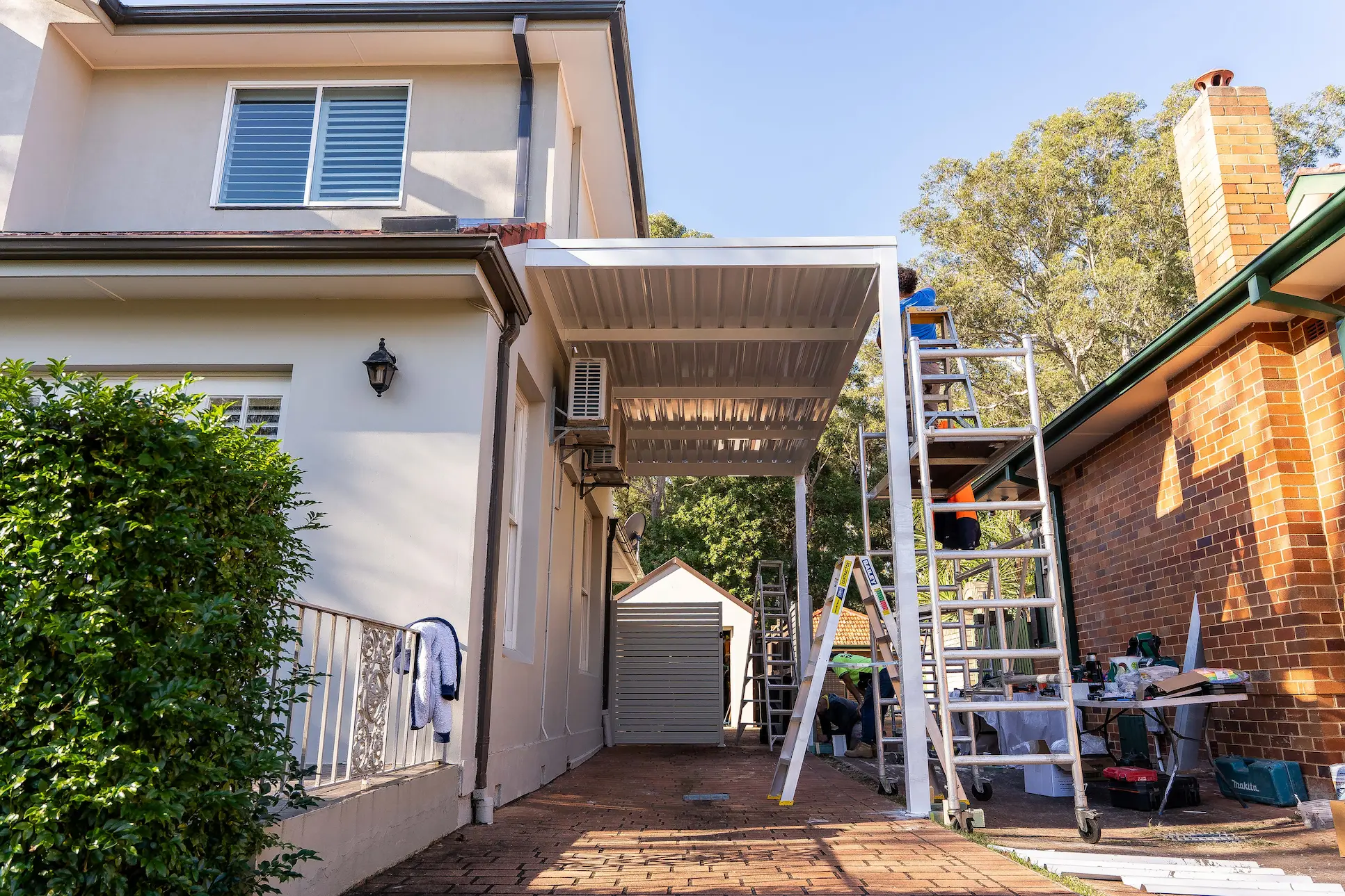 Side elevation of the skillion carport roof against the residential frontage